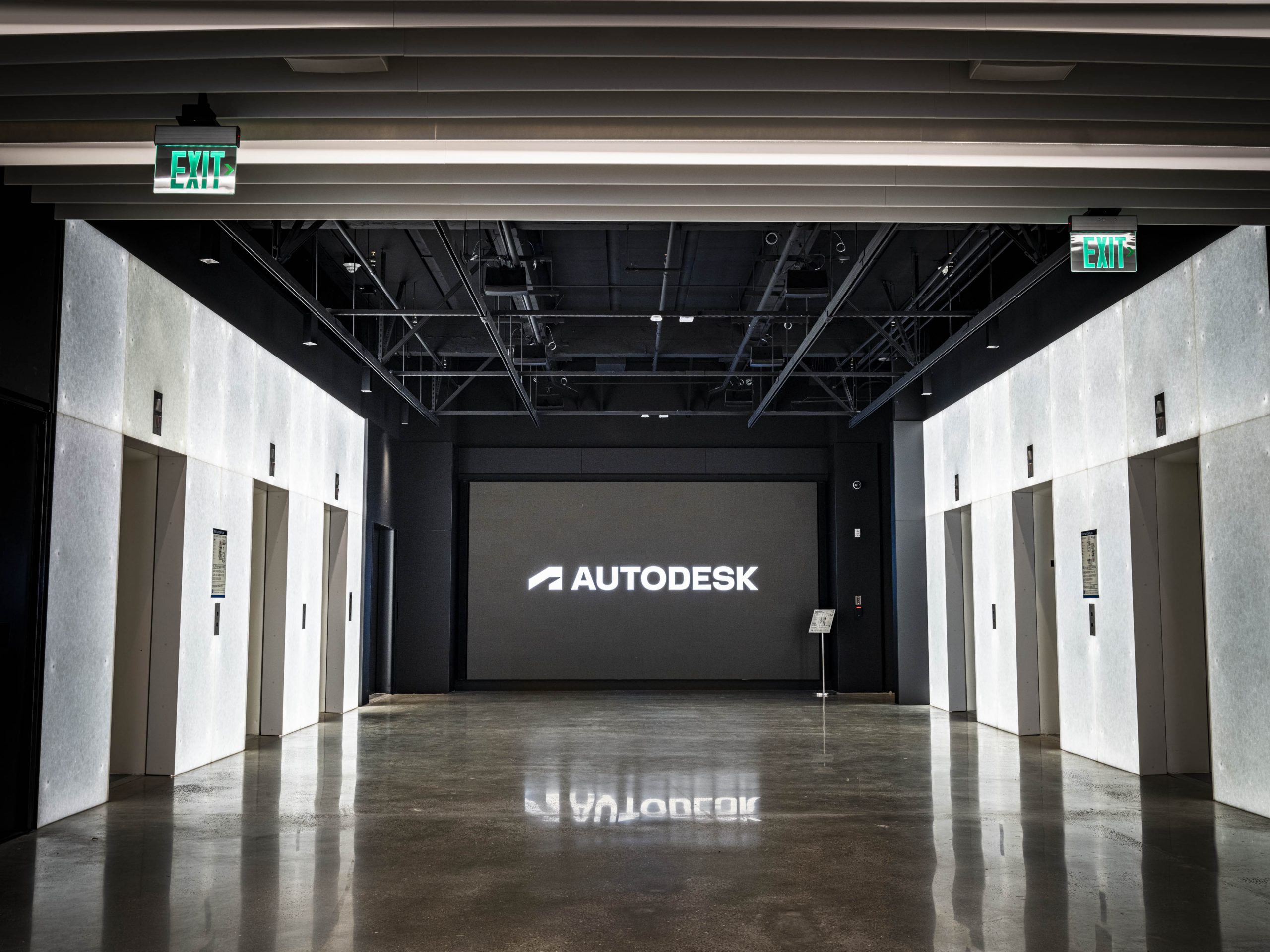 Autodesk Gallery elevator lobby, with the Autodesk logo on a large illuminated display